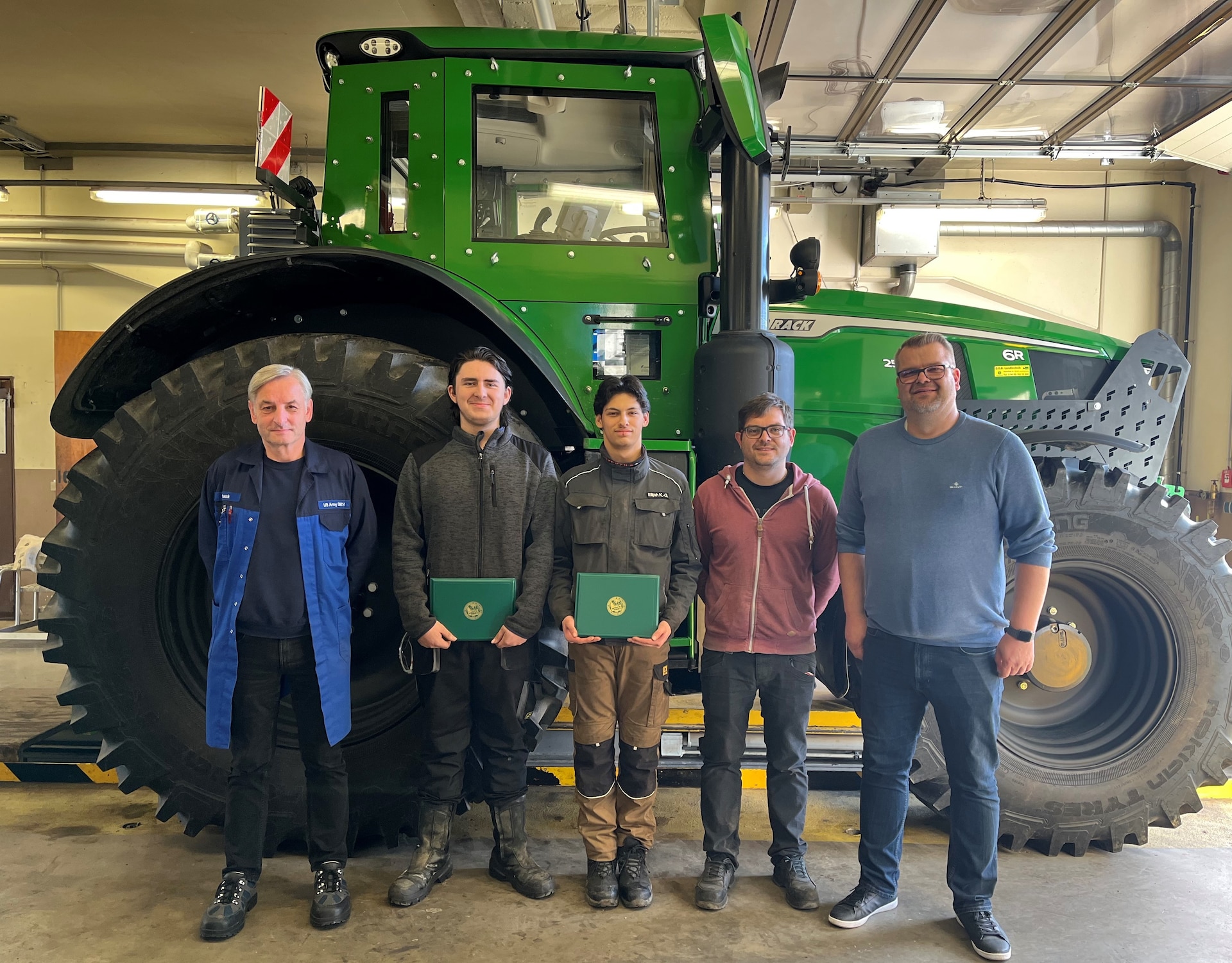 Bastian Lindner and Elijah Kossligk-Gallegos received certificates of appreciation Nov. 22 for completing an intern program with Base Support Operations Maintenance. Pictured here (from left to right) are Anton Gnauck, a shop foreman and BASOPS Maintenance apprenticeship leader; Lindner; Kossligk-Gallegos; Michael Bauer, a shop foreman and board of examiners member for the Chamber of Crafts; and Marko Friedrichs, BASOPS Maintenance manager. (U.S. Army courtesy photo)