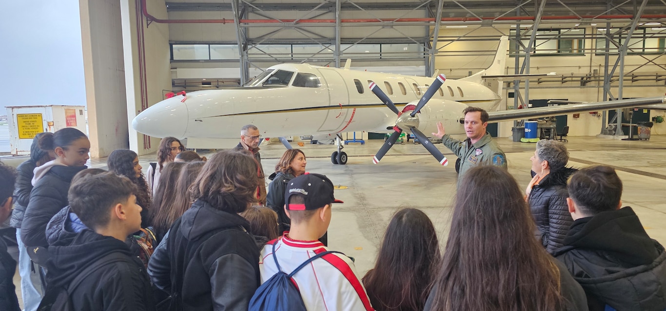 241122-N-RF791-2552 NAVAL SUPPORT ACTIVITY NAPLES, Italy (November 22, 2024) Students from Instituto Comprensivo 1 Ariosto Middle School in Arzano, Naples, learn about U.S. Naval aircraft during a base tour onboard Naval Support Activity (NSA) Naples, Italy, Nov. 22, 2024. The students also had the opportunity to gain cultural insights from U.S. Navy personnel. NSA Naples is an operational ashore base that enables U.S., allied, and partner nation forces to be where they are needed, when they are needed to ensure security and stability in Europe, Africa, and Southwest Asia. (U.S. Navy photo by Lt. j.g. Valentine K. Mulango)