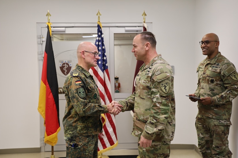 Dr. von Uslar and CSM Brunnell handshake as both the 68th TMC and MMCC-E continue to build its relationship