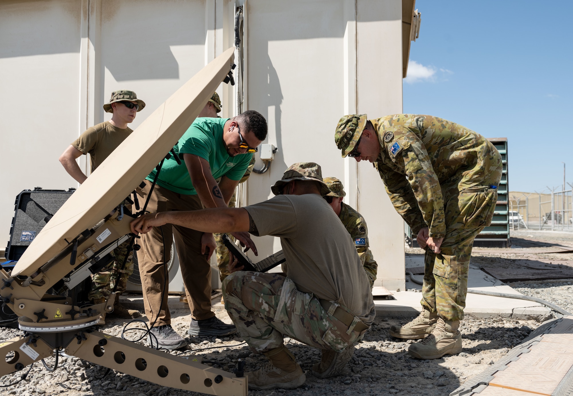 U.S. Air Force communications specialists assigned to the 380th Air Expeditionary Wing, assemble a Communications Fly Away Kit.