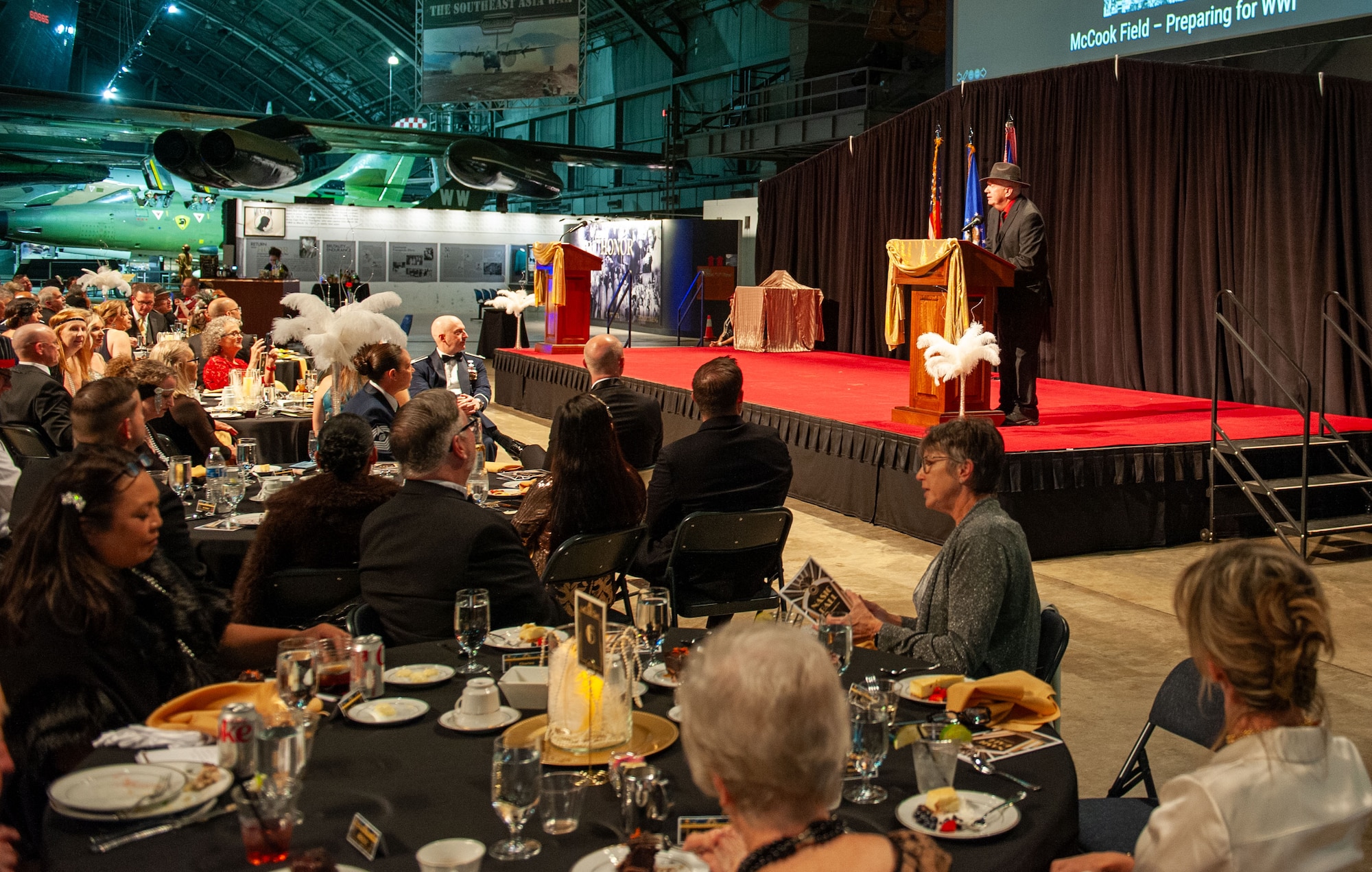Robert Young, National Air and Space Intelligence Center historian, gives tailored history remarks during the NASIC Ball, at the National Museum of the U.S. Air Force, Wright-Patterson Air Force Base, Ohio, Nov. 16, 2024. Young focused on NASIC’s heritage, highlighting key moments in the center’s history and relevance to national security.
