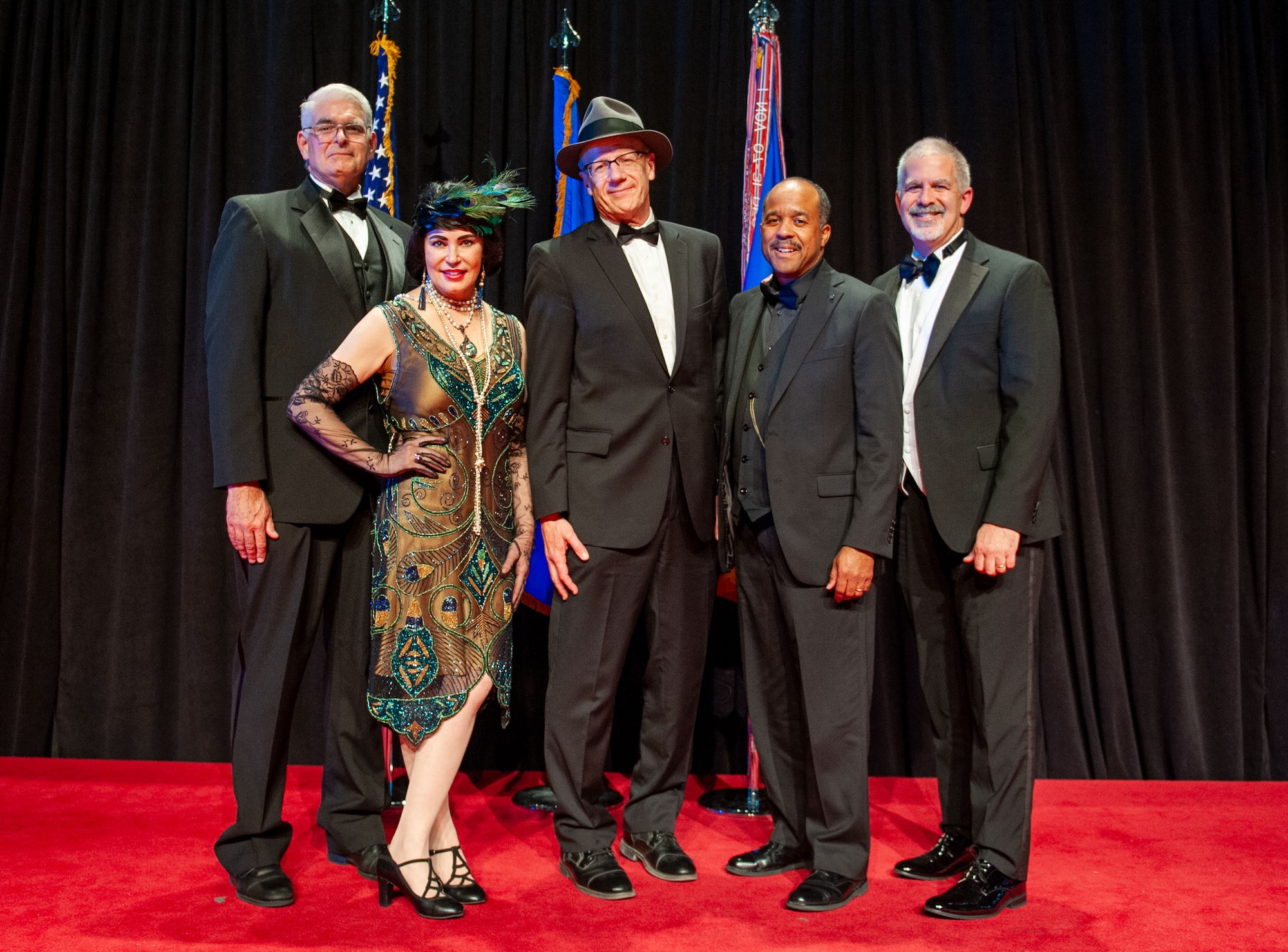 Chris Mayrand (center), Integrated C4ISR Analysis Squadron senior intelligence analyst and NASIC’s 2024 Watson Award recipient, poses with past winners of the award. Flanking Mayrand from left to right are Joseph Herrmann, NASIC chief of staff; Michelle Busbee, Networked Weapons & Modeling Group technical advisor; Tyree Wilborne, Aircraft Analysis Squadron senior intelligence analyst; and Jeffrey Skudlarek, NASIC deputy chief of staff. The Major General Watson Award is a prestigious honor that recognizes those individuals who over the course of their career, have made lasting and positive contributions to NASIC. This year’s award was presented during the NASIC Ball, at the National Museum of the U.S. Air Force, Wright-Patterson Air Force Base, Ohio, Nov. 16, 2024.