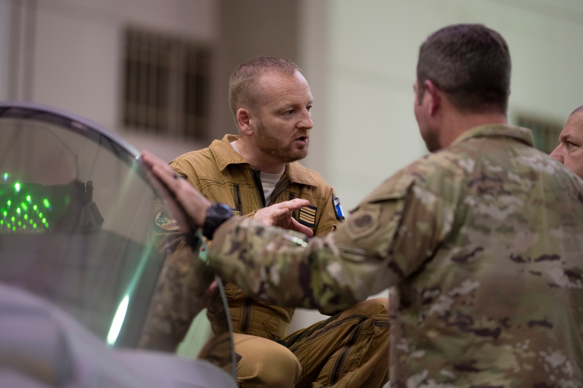 Base Aerienne 104 commander Col. David Pappalardo talks with 380th Air Expeditionary Wing leadership.
