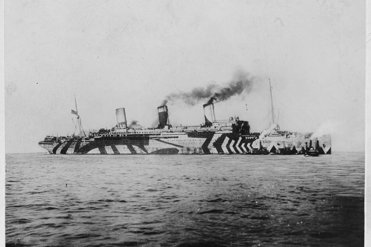 A ship steams across the ocean.