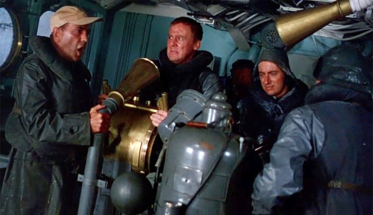 Sailors inside a ship look distraught.