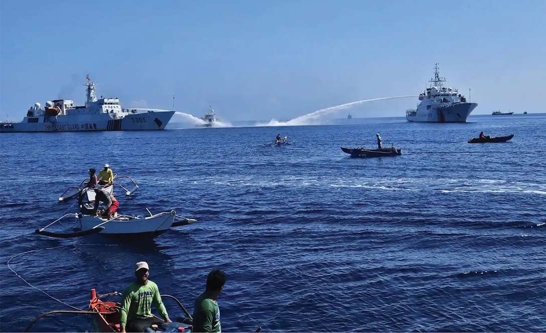 China Coast Guard vessels shoot water cannons at fishermen on 10 December 2023 in Bajo de Masinloc (also known as Scarborough Shoal), disputed territory claimed by the Philippines and China.