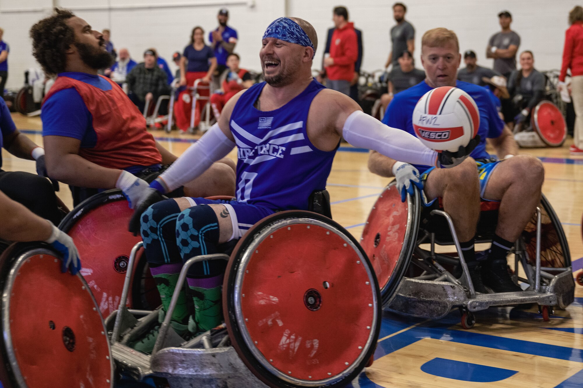 Retired SMSgt. Jon Geren scores a point in a wheelchair rugby game.