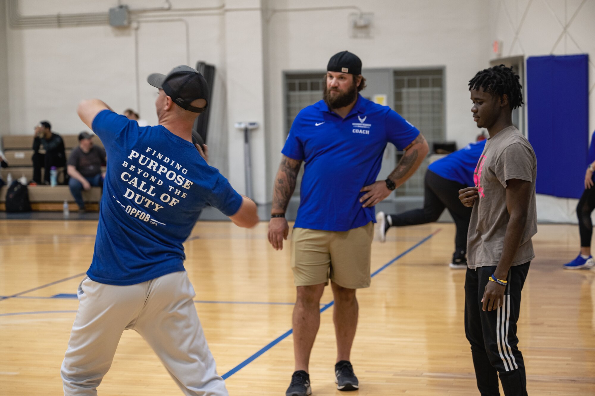 An Air Force Wounded Warrior participant simulates a shot put throw.