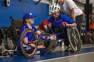 An Air Force Wounded Warrior participant learns how to ride a wheelchair bicycle.