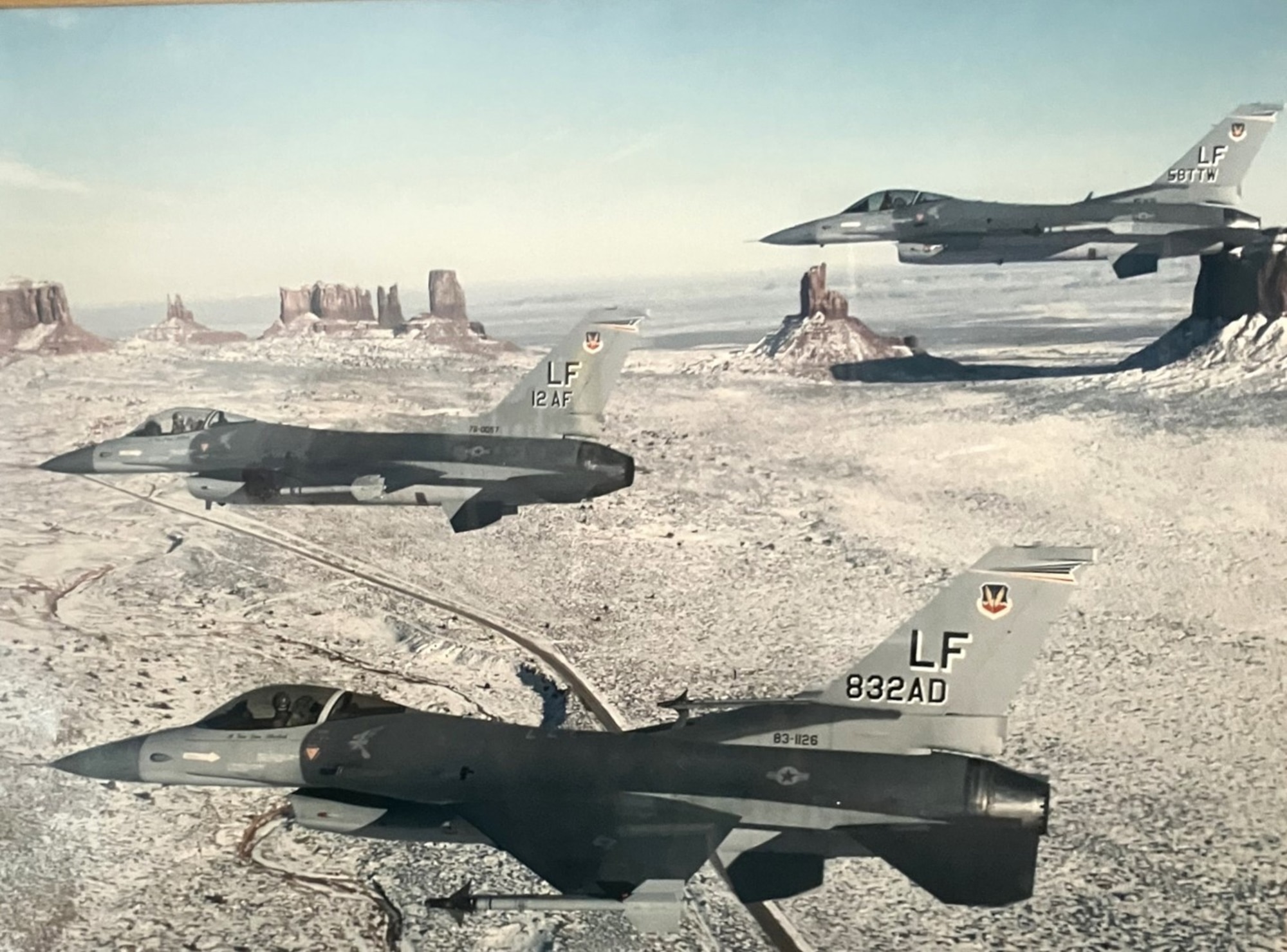 Three U.S. Air Force F-16 Falcons assigned to the 58th Tactical Training Wing fly in formation over Arizona, 1988.