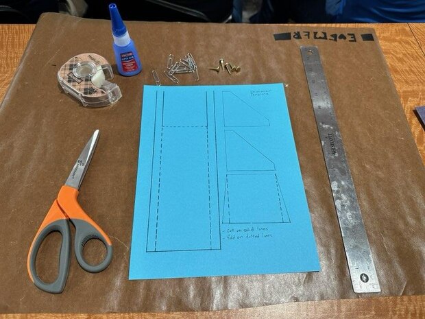 School supplies lay on a desk at the U.S. Naval Academy in Annapolis in October 2024. Science, technology, engineering, and mathematics (STEM) team leads from the Department of Navy’s Strategic Systems Programs (SSP) visited the Naval Academy’s STEM Center for Education and Outreach for an offsite workshop. SSP personnel learned hands-on defense-related STEM activities they can bring to the classroom at their local communities. Each activity is specifically designed to introduce students to various engineering disciplines such as electrical, aeronautical, mechanical, and biological, and use affordable, low-cost materials for assembly projects.