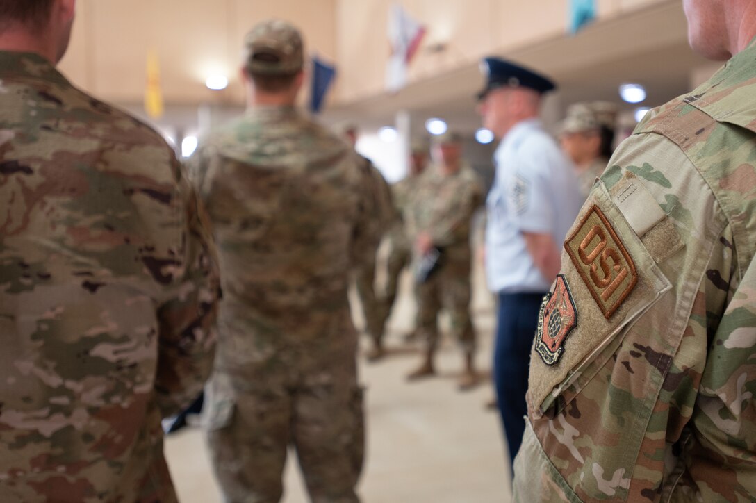 Air Force Office of Special Investigations Special Agents, entering the senior noncommissioned officer ranks following an induction ceremony, following a tour of the 320th Training Squadron at Joint Base San Antonio - Lackland, Texas. As part of their weeklong events, Special Agents attended a Basic Military Training graduation.