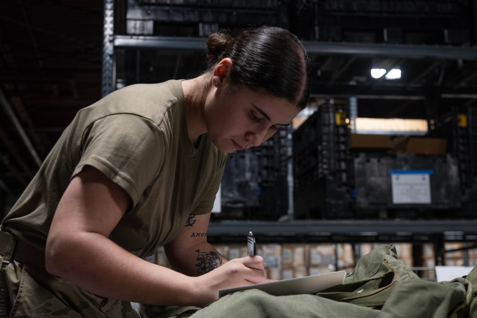 Airman 1st Class Autumn Dunavan, 4th Logistics Readiness Squadron Individual Protective Equipment (IPE) Journeyman, inspects and inventories personal protective equipment.