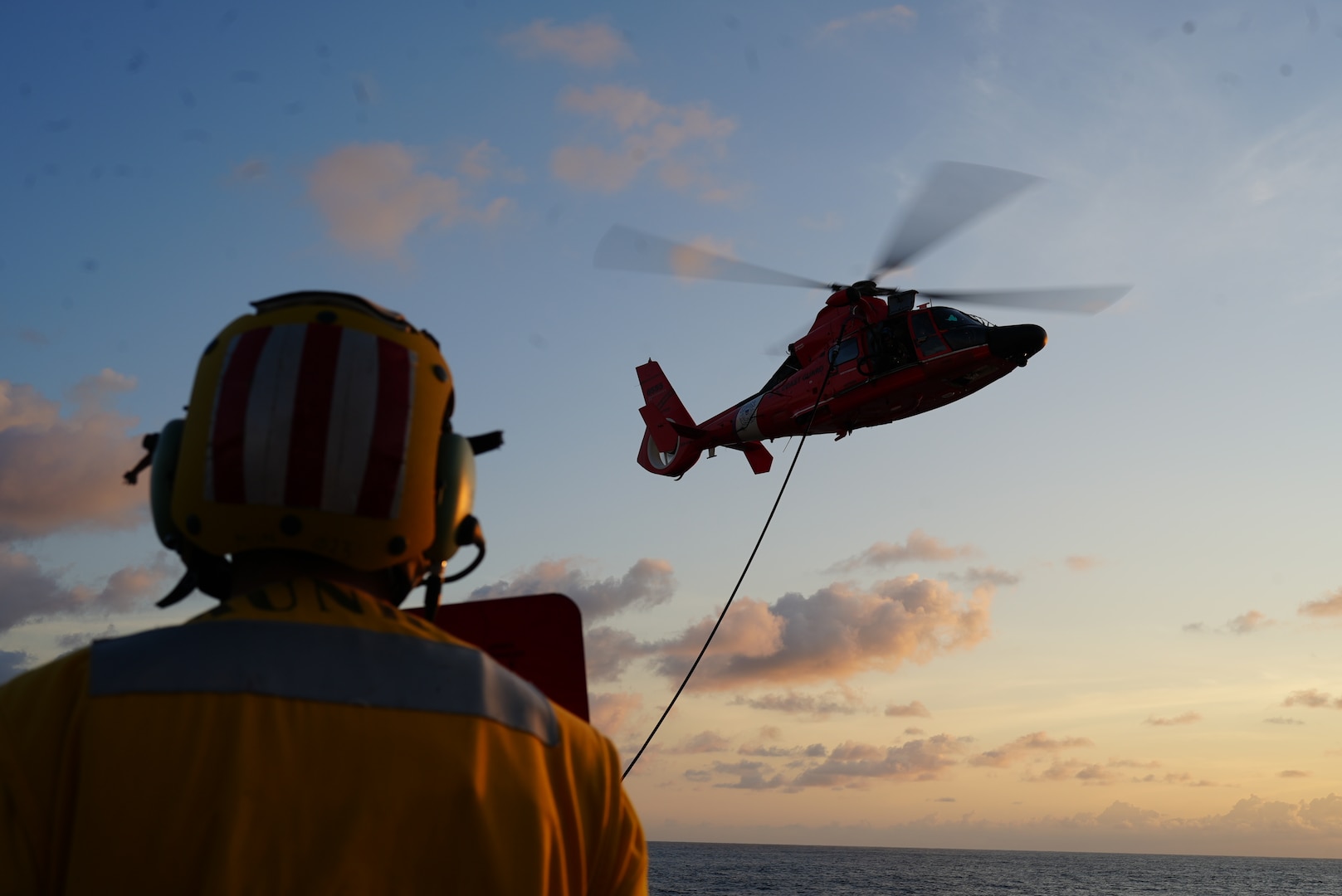 Ensign Jesse Johnson conducts a Helicopter In-Flight Refueling with the embarked U.S. Coast Guard’s Helicopter Interdiction Tactical Squadron (HITRON). The HITRON unit provided U.S. Coast Guard Cutter Munro (WMSL 755) with airborne use-of-force capabilities in the maritime law enforcement domain, directly supporting the successful interdiction of non-compliant vessels. (U.S. Coast Guard photo by L.t. j.g. Samika Lewis)