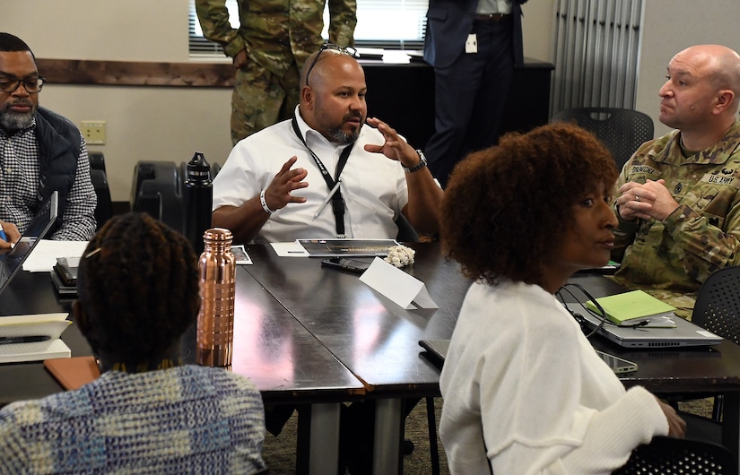 Jason Acevedo, civilian deputy director of AMLC’s Integrated Logistics Support Center, talks with team members during a strategy review as part of the Commander’s Forum, hosted Nov. 18-21 by U.S. Army Medical Logistics Command at Fort Detrick, Maryland. (Photo Credit: C.J. Lovelace)
