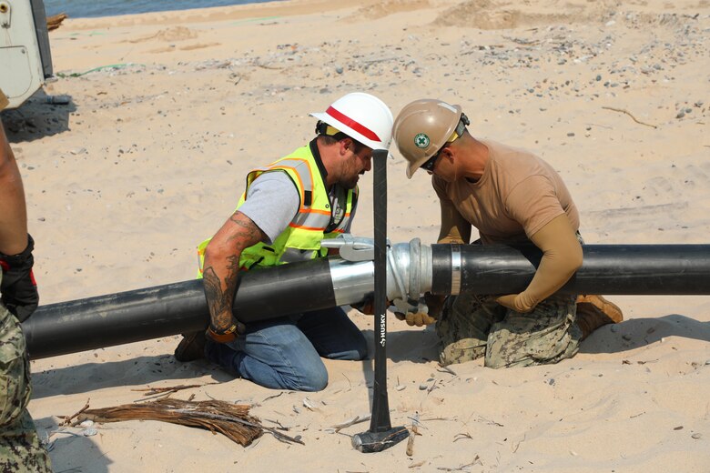 Land-based image of dredging operations at Little Lake Harbor, Michigan.