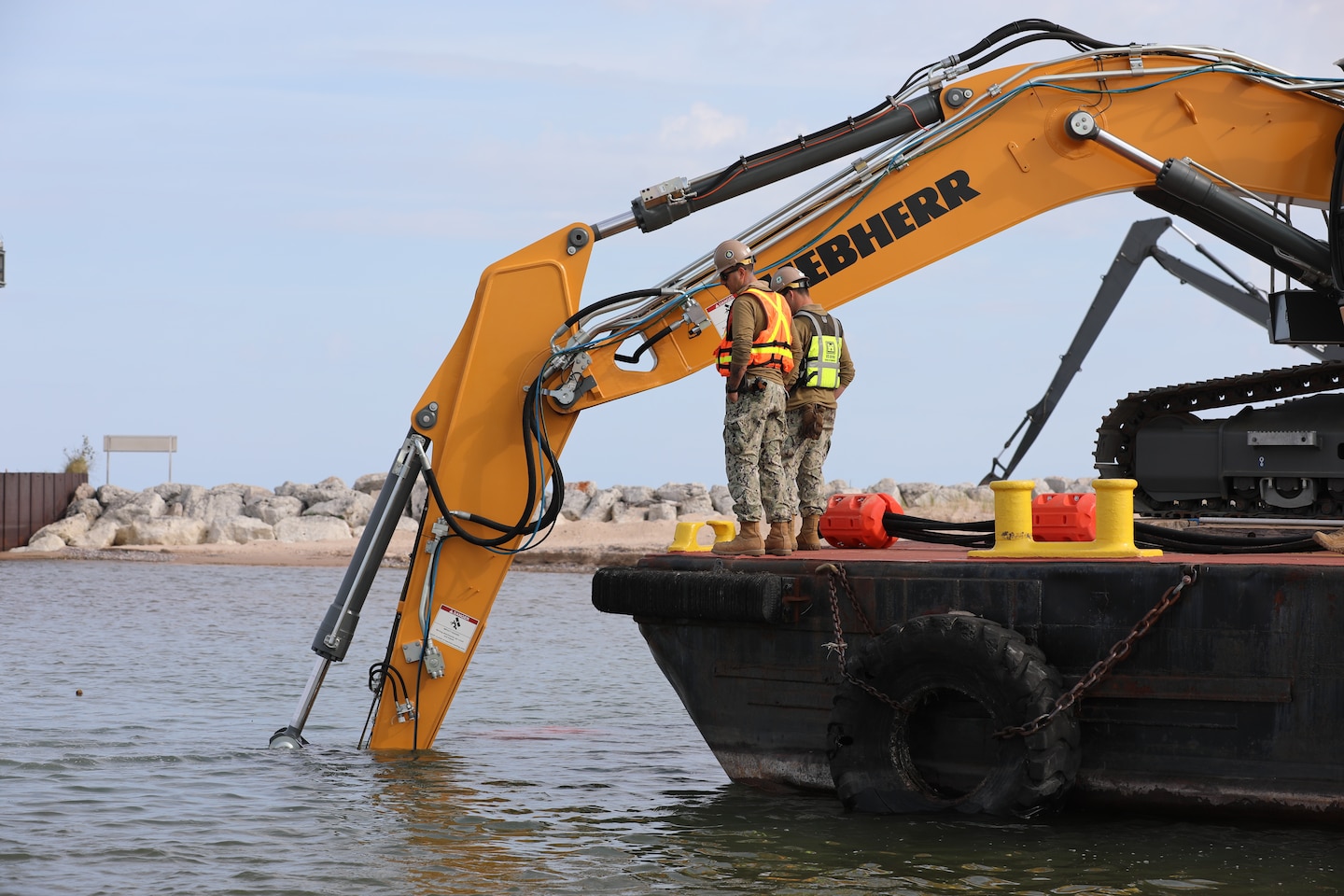 Land-based image of dredging operations at Little Lake Harbor, Michigan.