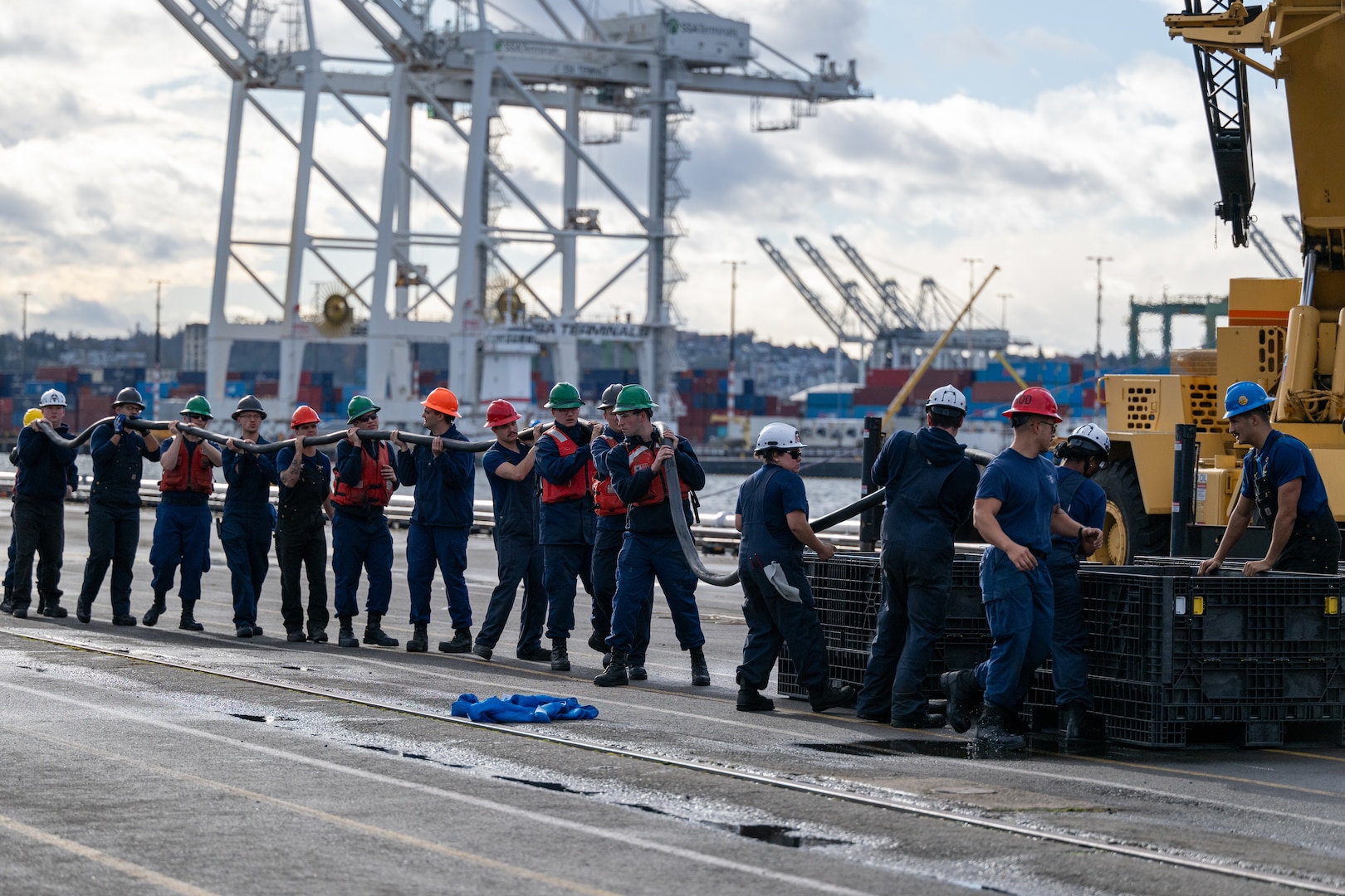 An electrical shore-tie is stored away as crew members from U.S. Coast Guard Cutter Polar Star (WAGB 10) make final preparations to get the vessel underway from Coast Guard Base Seattle, Washington, Nov. 22, 2024. The crew of the Polar Star are beginning their voyage to Antarctica in support of Operation Deep Freeze, the annual joint military mission to resupply the United States Antarctic stations. (U.S. Coast Guard photo by Petty Officer 2nd Class Briana Carter)