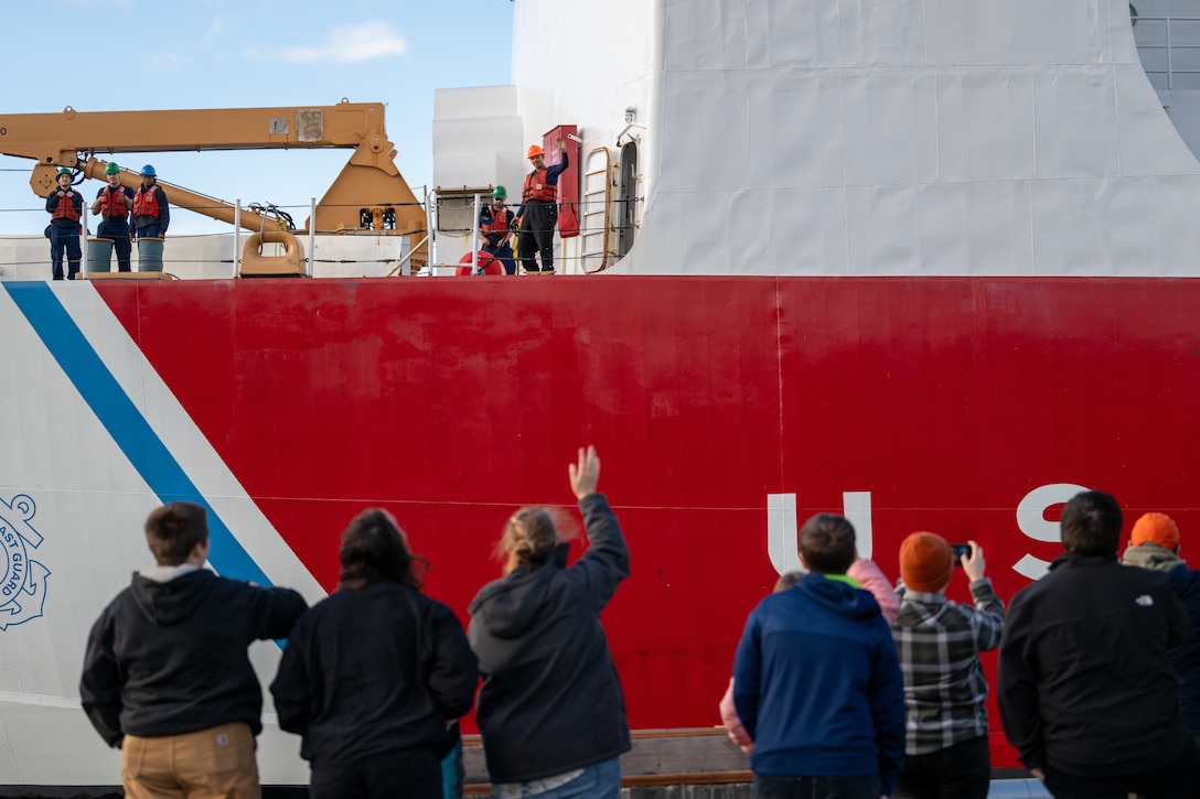 Family members wave to the crew aboard U.S. Coast Guard Cutter Polar Star (WAGB 10) as the vessel begins to push away from the pier at Coast Guard Base Seattle, Washington, Nov. 22, 2024. The crew of the Polar Star are beginning their voyage to Antarctica in support of Operation Deep Freeze, the annual joint military mission to resupply the United States Antarctic stations. (U.S. Coast Guard photo by Petty Officer 2nd Class Briana Carter)