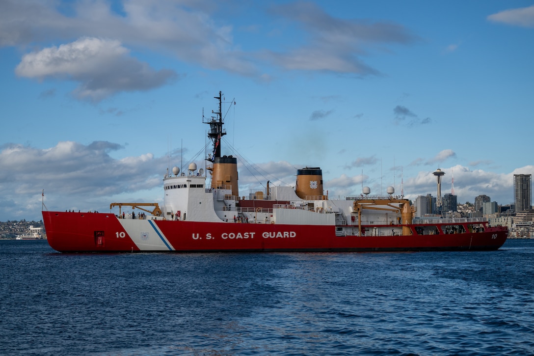 U.S. Coast Guard Cutter Polar Star (WAGB 10) transits across Elliott Bay after departing Coast Guard Base Seattle, Washington, Nov. 22, 2024. The crew of the Polar Star are beginning their voyage to Antarctica in support of Operation Deep Freeze, the annual joint military mission to resupply the United States Antarctic stations. (U.S. Coast Guard photo by Petty Officer 2nd Class Briana Carter)