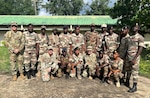 U.S. Army 1st Sgt. Derek Smith, 177th Regional Training Institute, Michigan National Guard; U.S. Air Force Capt. Andrew Layton, bilateral affairs officer, Michigan National Guard; and U.S. Army Master Sgt. Daniel Blaser, chief instructor, 177 RTI, with instructor cadre members at the Republic of Sierra Leone Armed Forces Training Center, Benguema, Sierra Leone, Nov. 19, 2024. The Michigan National Guard and the Republic of Sierra Leone Armed Forces signed an agreement Sept. 12 to become partners under the State Partnership Program.