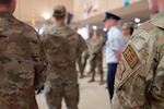Air Force Office of Special Investigations Special Agents, entering the senior noncommissioned officer ranks following an induction ceremony, following a tour of the 320th Training Squadron at Joint Base San Antonio - Lackland, Texas. As part of their weeklong events, Special Agents attended a Basic Military Training graduation.