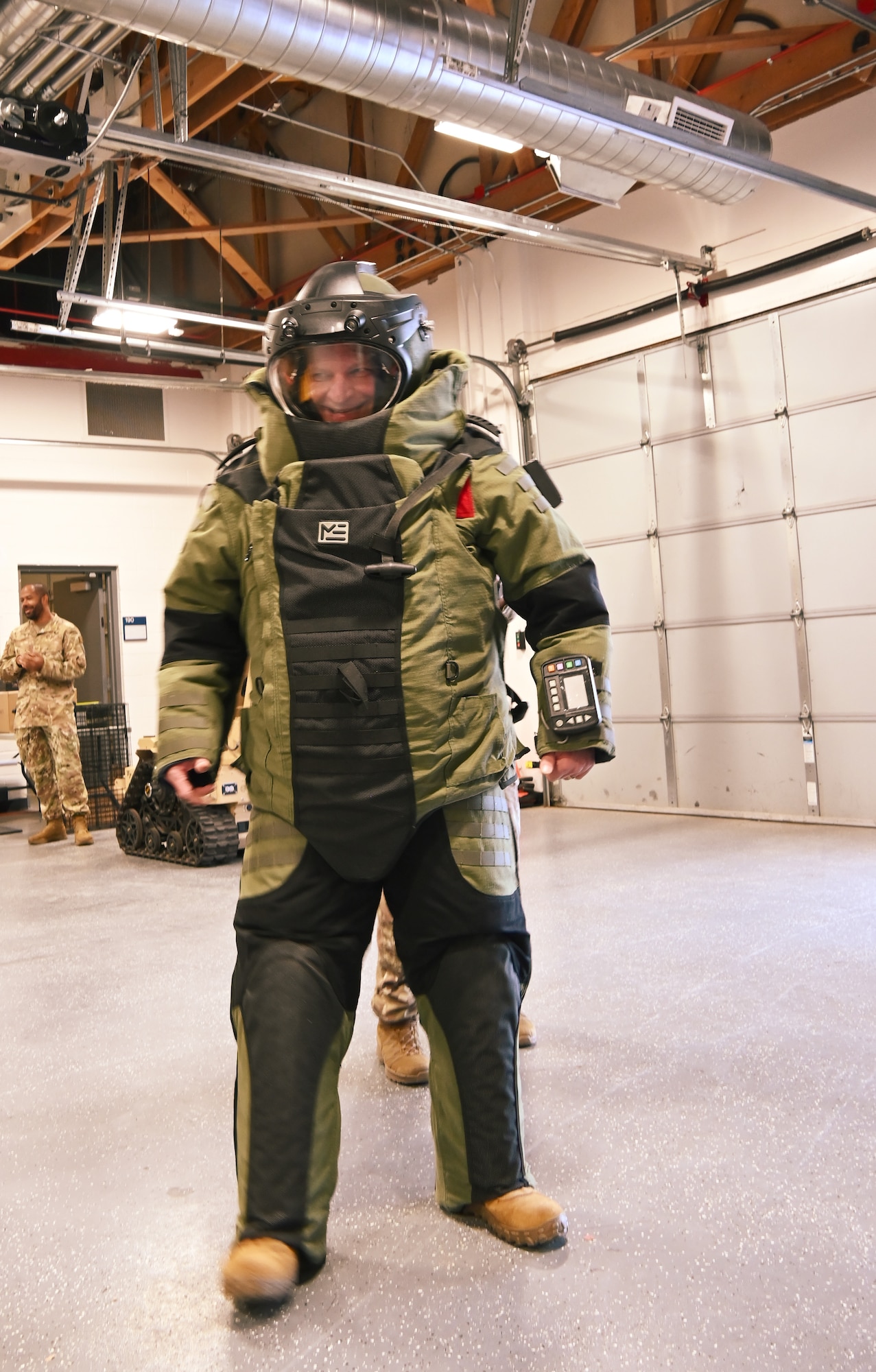 U.S. Space Force Col. Kenneth Klock, Space Base Delta 1 commander, dons an 80-pound explosive ordnance disposal 10-suit as part of an immersion tour of the 21st Civil Engineer Squadron on Peterson Space Force Base, Colorado, Nov. 21, 2024. The 21st CES EOD unit can be called upon by emergency services across the state to aid in disposal of unexploded ordnance. (U.S. Space Force photo by Christopher L. Ingersoll)