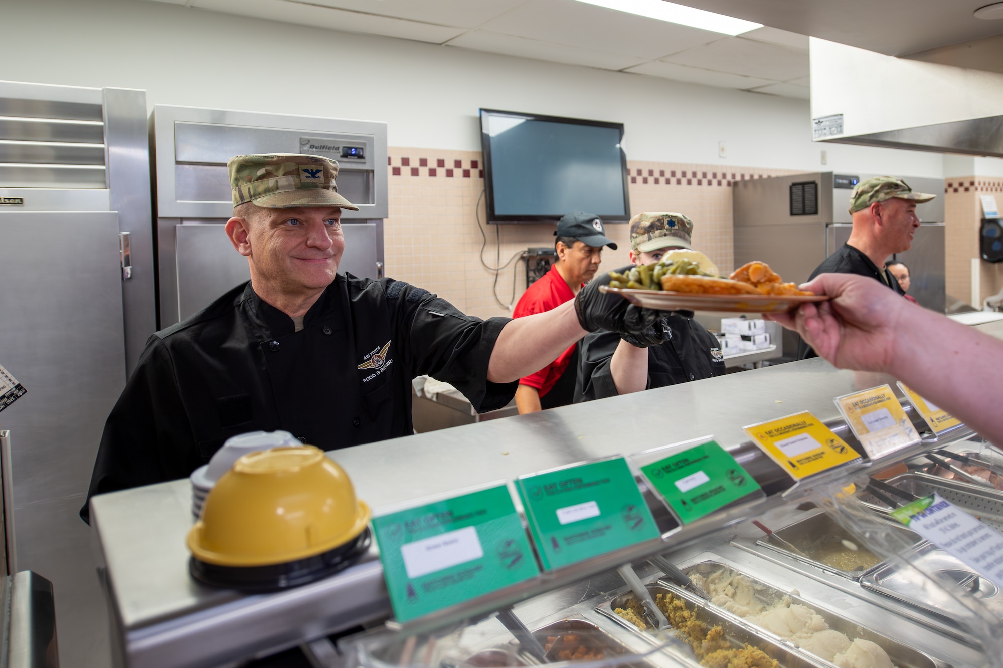 Commander serving food.