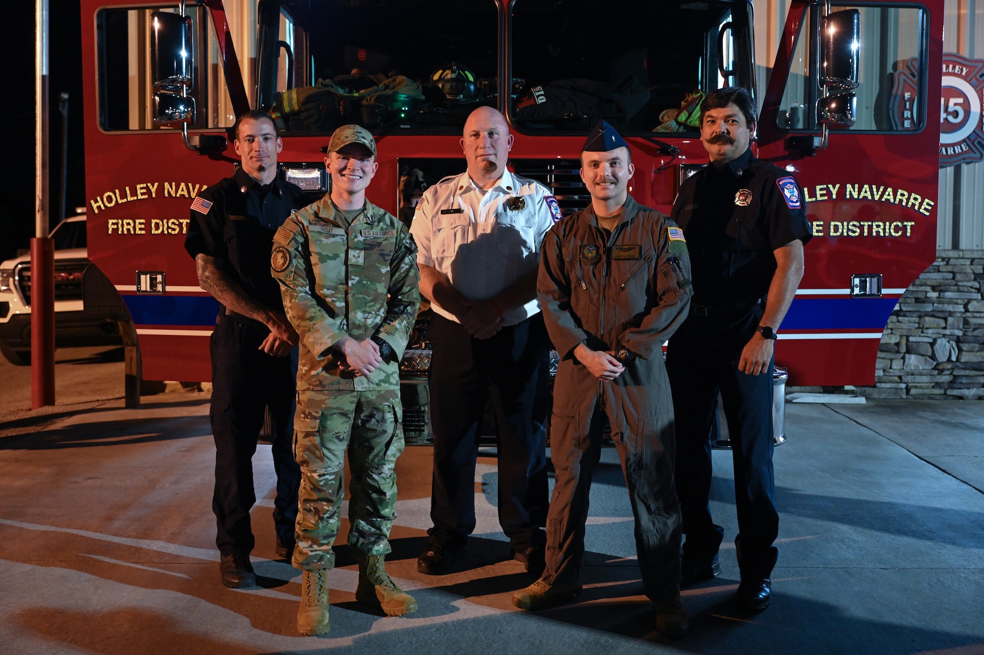 U.S. Air Force Airmen, civilians and Holley-Navarre Fire District firefighters pose for a group photo at the Holley-Navarre Fire District Station 45, in Navarre Florida, Nov. 25, 2024.