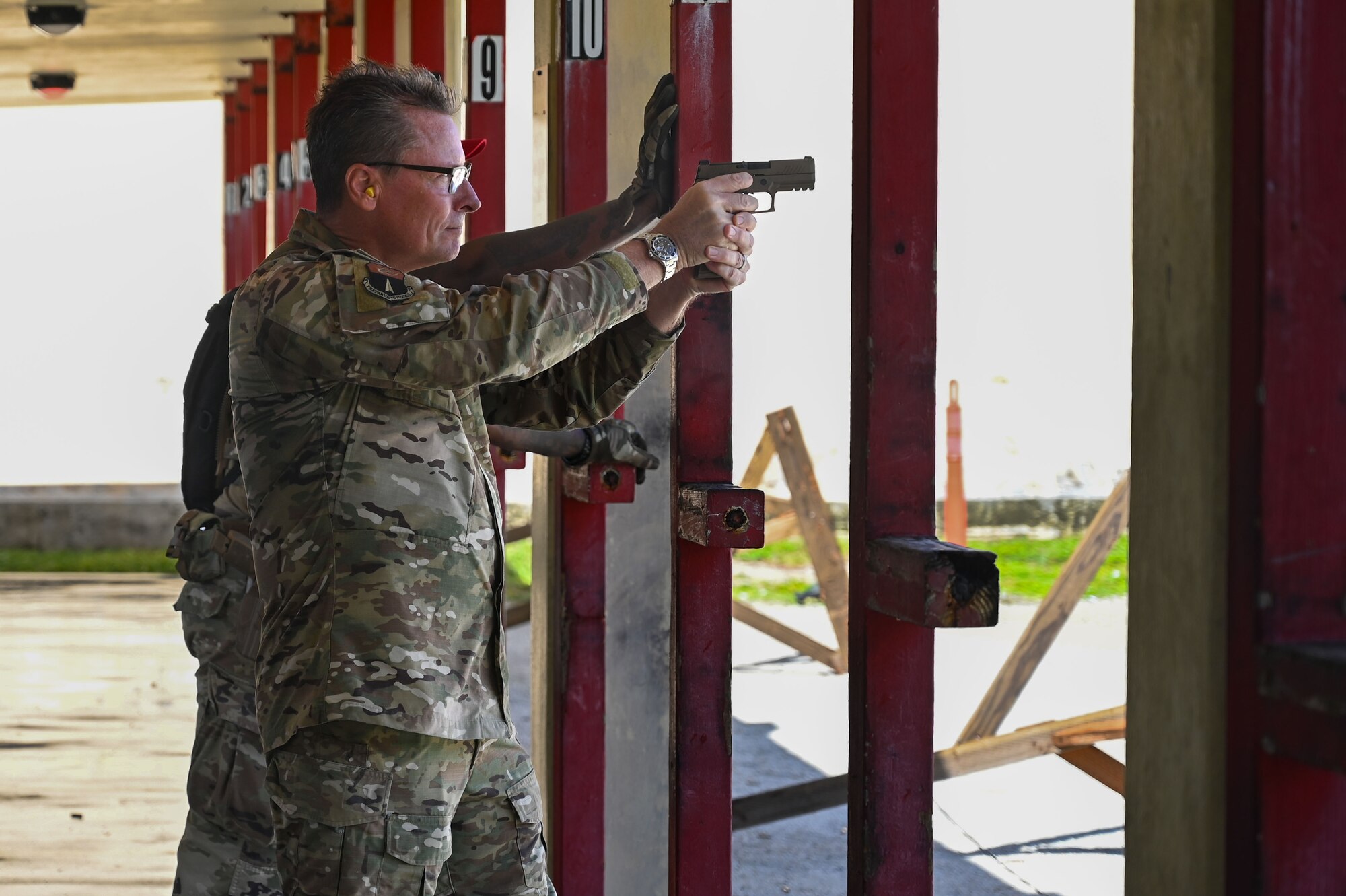 U.S. Air Force Brig. Gen. Thomas B. Palenske, commander of the 36th Wing, aims downrange during a shooting competition on Andersen Air Force Base, Guam, Nov. 22, 2024. Palenske and the 36th Wing hosted the inaugural 2024 Battle of the Branches for all military branches and local law enforcement on island to compete in. (U.S. Air Force photo by Airman 1st Class Natasha Ninete)