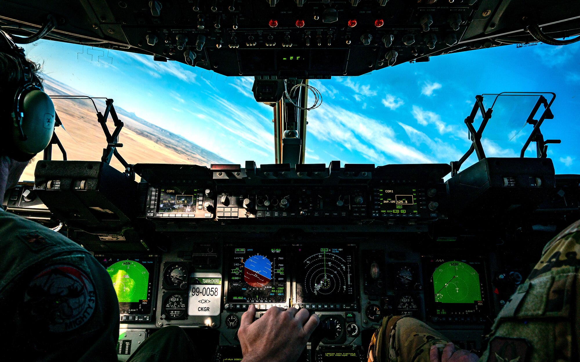 U.S. Air Force Maj. Andrew Mazzarelli (left), 313th Airlift Squadron chief of standardization and evaluation, flies a C-17 Globemaster III alongside his co-pilot, Lt. Col. Bruce Cohn (right), 313th Airlift Squadron commander.