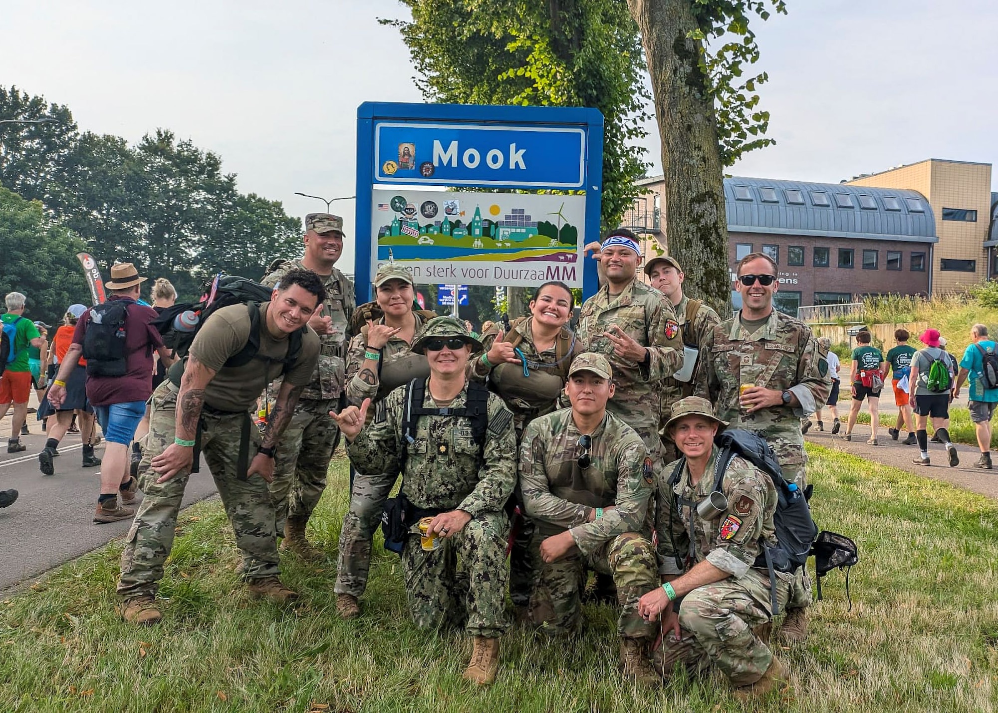 Tech. Sgt. Alexander Bertsch, an air traffic control supervisor in the 412th Operational Support Squadron here, wearing a USA headband, gathers for a photo with teammates after completing the Nijmegan March, the world’s largest multiple-day marching event, in July. The team joined 47,000 or so friends from some 70 countries as they traversed villages and the countryside in and around the town of Nijmegan, Netherlands during the 100-mile, four-day event.