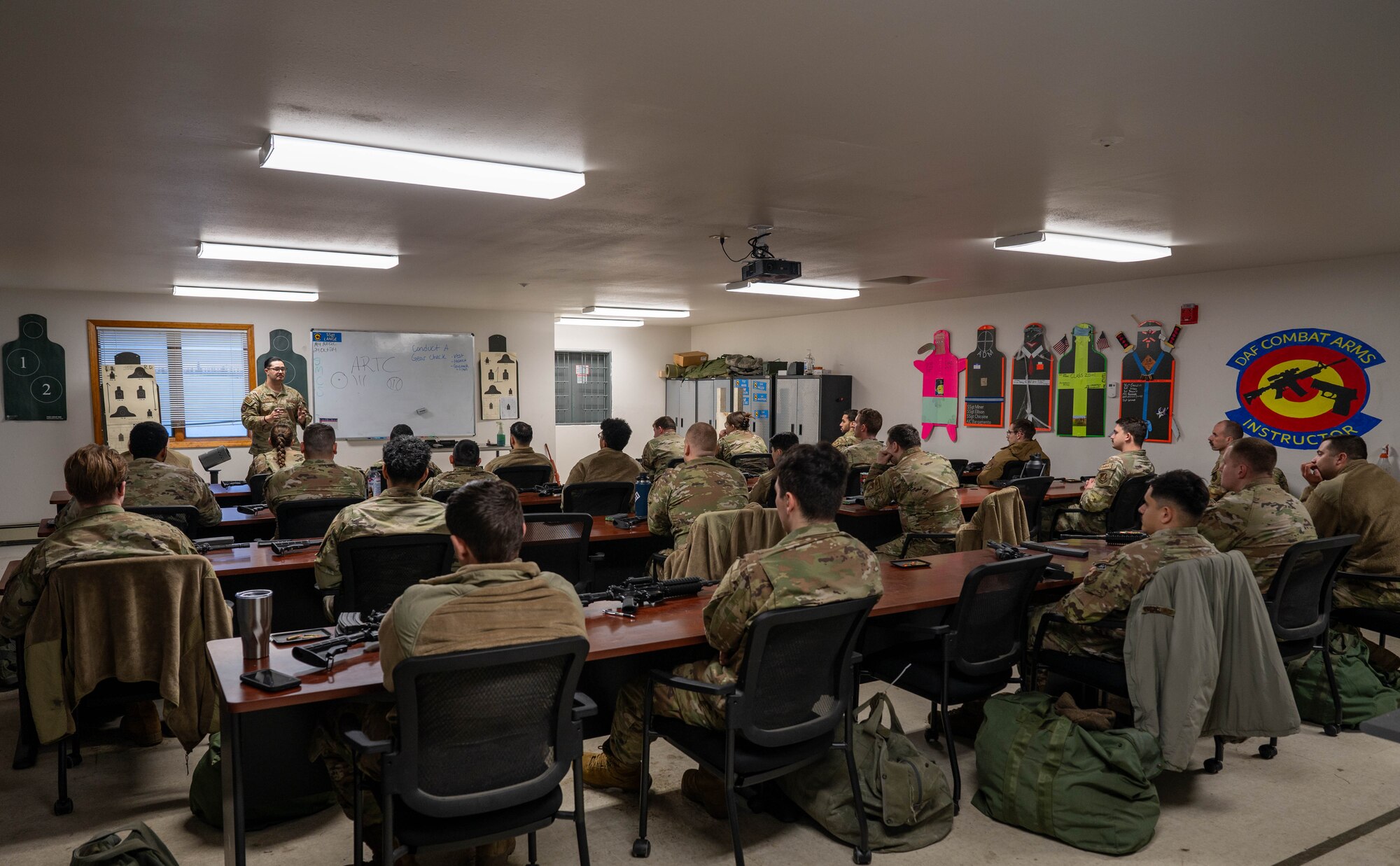 U.S. Air Force Staff Sgt. Antonio Lange, 354th Security Forces Squadron Combat Arms Training and Maintenance instructor, speaks to students during the classroom portion of the course at Eielson Air Force Base, Alaska, Oct. 23, 2024.