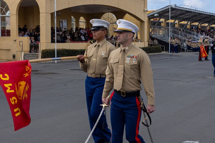 U.S. Marine Corps Capt. Michael Held, right, follow series commander with Mike Company, 3rd Recruit Training Battalion, participates in a graduation ceremony at Marine Corps Recruit Depot San Diego, California, Nov. 15, 2024. Graduation took place at the completion of the 13-week transformation, which included training for drill, marksmanship, basic combat skills, and Marine Corps customs and traditions. (U.S. Marine Corps photo by Lance Cpl. Jacob B. Hutchinson)