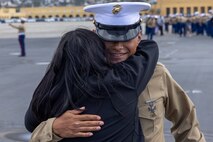 A U.S. Marine with Mike Company, 3rd Recruit Training Battalion, is greeted by his guest following his graduation ceremony at Marine Corps Recruit Depot San Diego, California, Nov. 15, 2024. Graduation took place at the completion of the 13-week transformation, which included training for drill, marksmanship, basic combat skills, and Marine Corps customs and traditions. (U.S. Marine Corps photo by Lance Cpl. Jacob B. Hutchinson)