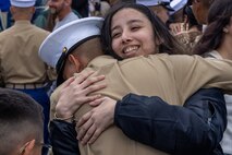 A U.S. Marine with Mike Company, 3rd Recruit Training Battalion, is greeted by his guest following his graduation ceremony at Marine Corps Recruit Depot San Diego, California, Nov. 15, 2024. Graduation took place at the completion of the 13-week transformation, which included training for drill, marksmanship, basic combat skills, and Marine Corps customs and traditions. (U.S. Marine Corps photo by Lance Cpl. Jacob B. Hutchinson)