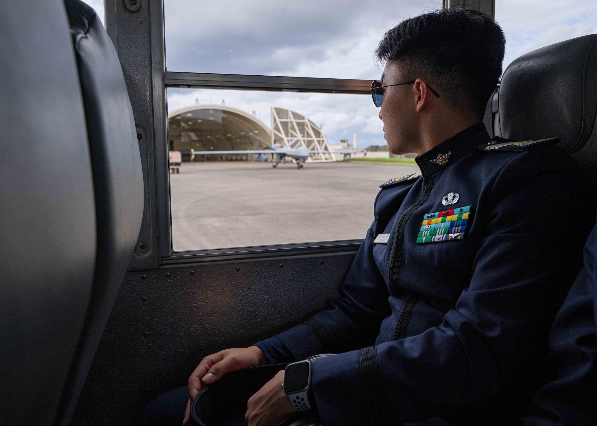 A Republic of Korea Air Force Academy student looks at an MQ-9 Reaper during a flightline tour at Kadena Air Base, Japan, Nov. 21, 2024.