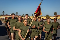 The new U.S. Marines of Alpha Company, 1st Recruit Training Battalion, participate in a motivational run at Marine Corps Recruit Depot San Diego, California, Nov. 21, 2024. The company motivational run is a three-mile cadence run conducted around the Depot and is the last physical training event the Marines will conduct before they graduate from MCRD San Diego. The event is also the first-time friends and families will see their newly transformed Marines. (U.S. Marine Corps photo by Lance Cpl. Jacob Hutchinson)