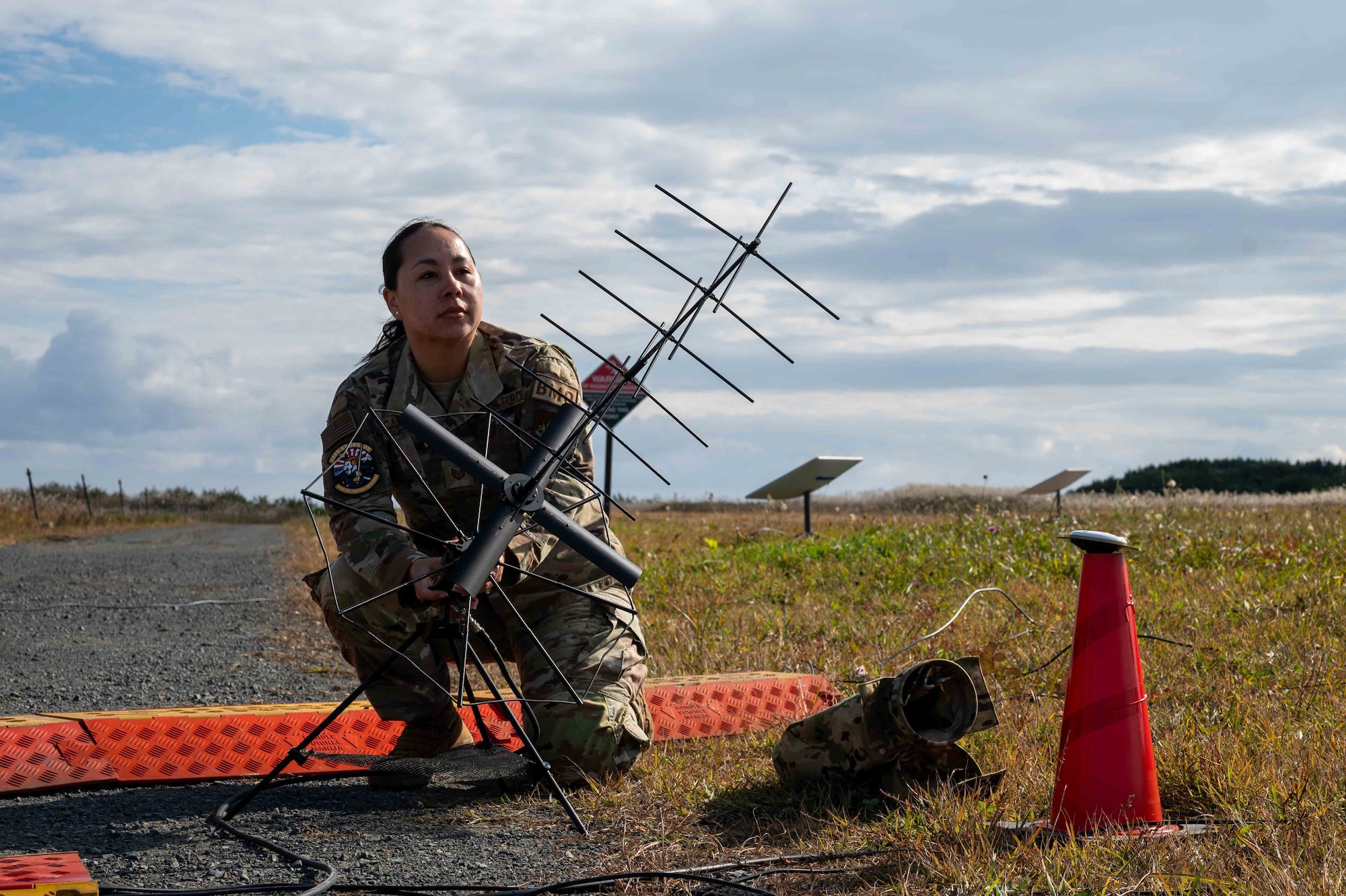 U.S. Air Force Tech. Sgt. Sherraye Carter, 623rd Air Control Squadron noncommissioned officer in charge of command and control integrations, assembles a  strategic communications antenna during Keen Sword 25 at Misawa Air Base, Japan, Oct. 28, 2024.