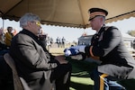 An Arkansas National Guard Honor Guardsman presents the flag to Trent Fletcher, U.S. Army Sgt. Charles Beaty’s nephew, during the sergeant’s funeral, Nov. 19, 2024.