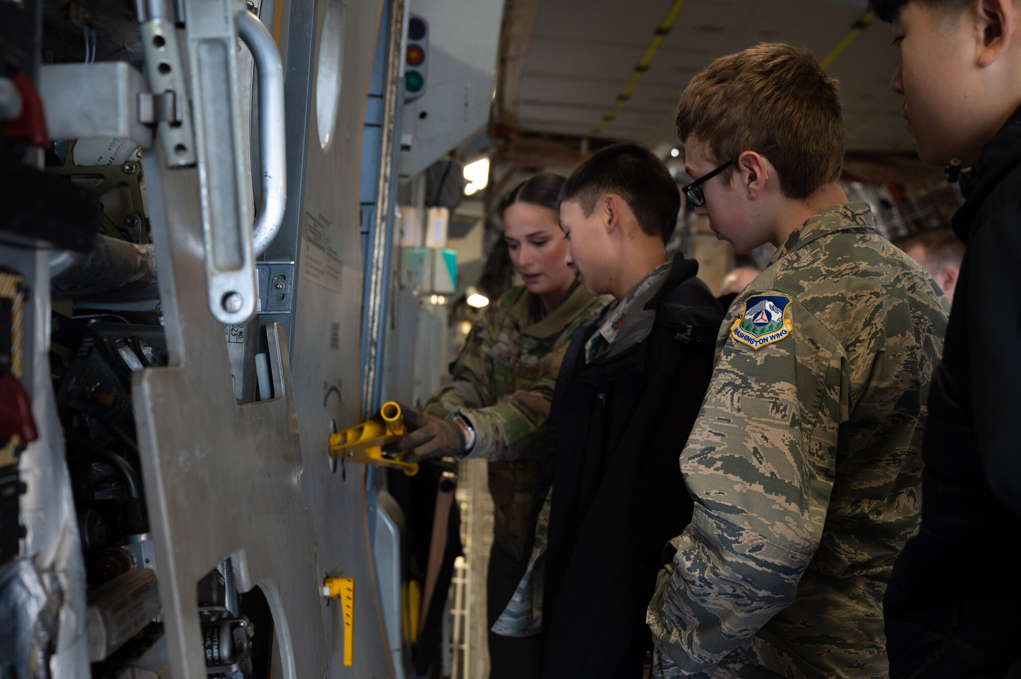 The 62d Airlift Wing hosted a tour for Washington Civil Air Patrol cadets at Joint Base Lewis-McChord, Washington, Nov. 23, 2024. CAP is the civilian auxiliary of the United States Air Force and a congressionally chartered nonprofit organization that operates under three missions: Aerospace Education, Emergency Services, and Cadet Programs. As an Aviation Inspiration and Mentorship Wing, the 62d AW seeks to foster community partnerships and educate and develop future and ready Airmen.