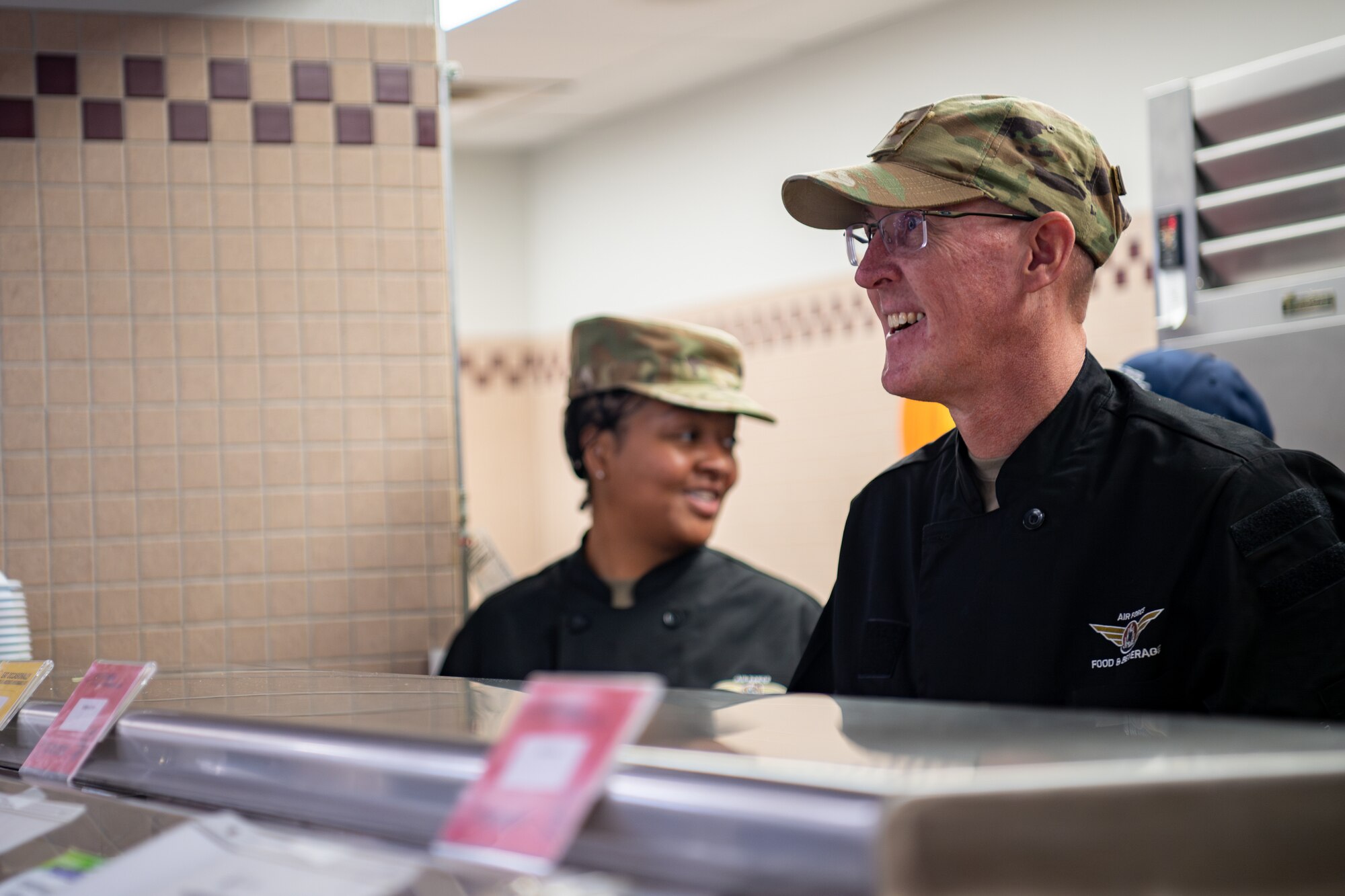 Uniformed members service food at FAC.