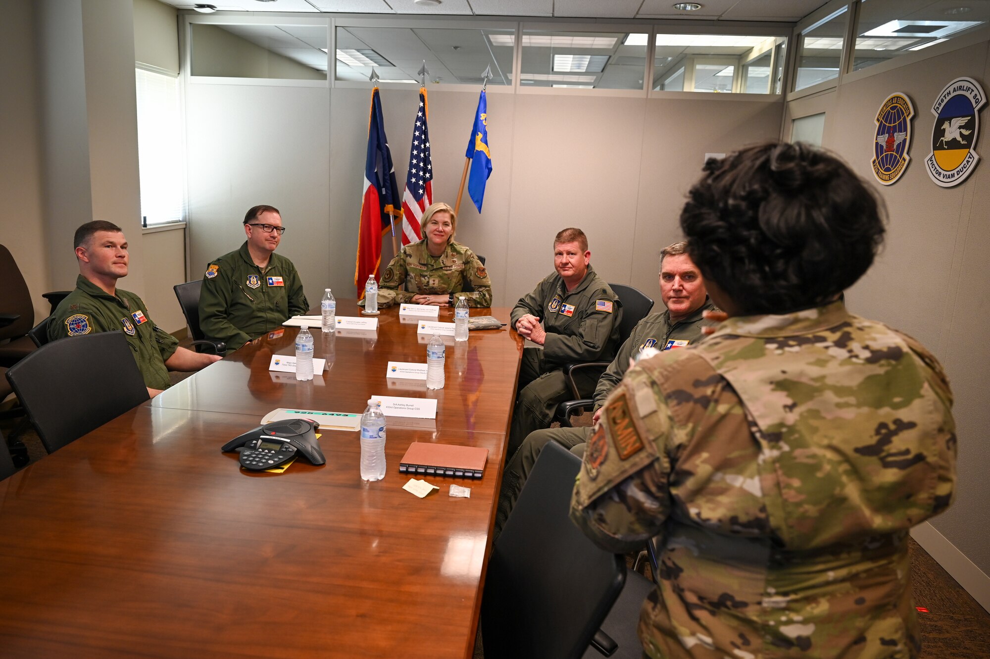 Senior Airman Ashley Burrell, right, 433rd Operations Group administration technician, briefs Maj. Gen. C. McCauley von Hoffman, Deputy to the Chief of Air Force Reserve, Headquarters U.S. Air Force, at Joint Base San Antonio-Lackland, Texas, Nov. 19, 2024.