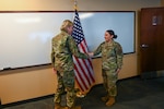 Senior Airman Erica Ortiz, a 433rd Maintenance Group production controller, accepts a commander’s coin from Maj. Gen. C. McCauley von Hoffman, Deputy to the Chief of Air Force Reserve, Headquarters U.S. Air Force, at Joint Base San Antonio-Lackland, Texas, Nov. 19, 2024.
