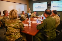 Senior Airman Erica Ortiz, a 433rd Maintenance Group production controller, briefs Maj. Gen. C. McCauley von Hoffman, Deputy to the Chief of Air Force Reserve, Headquarters U.S. Air Force, at Joint Base San Antonio-Lackland, Texas, Nov. 19, 2024.