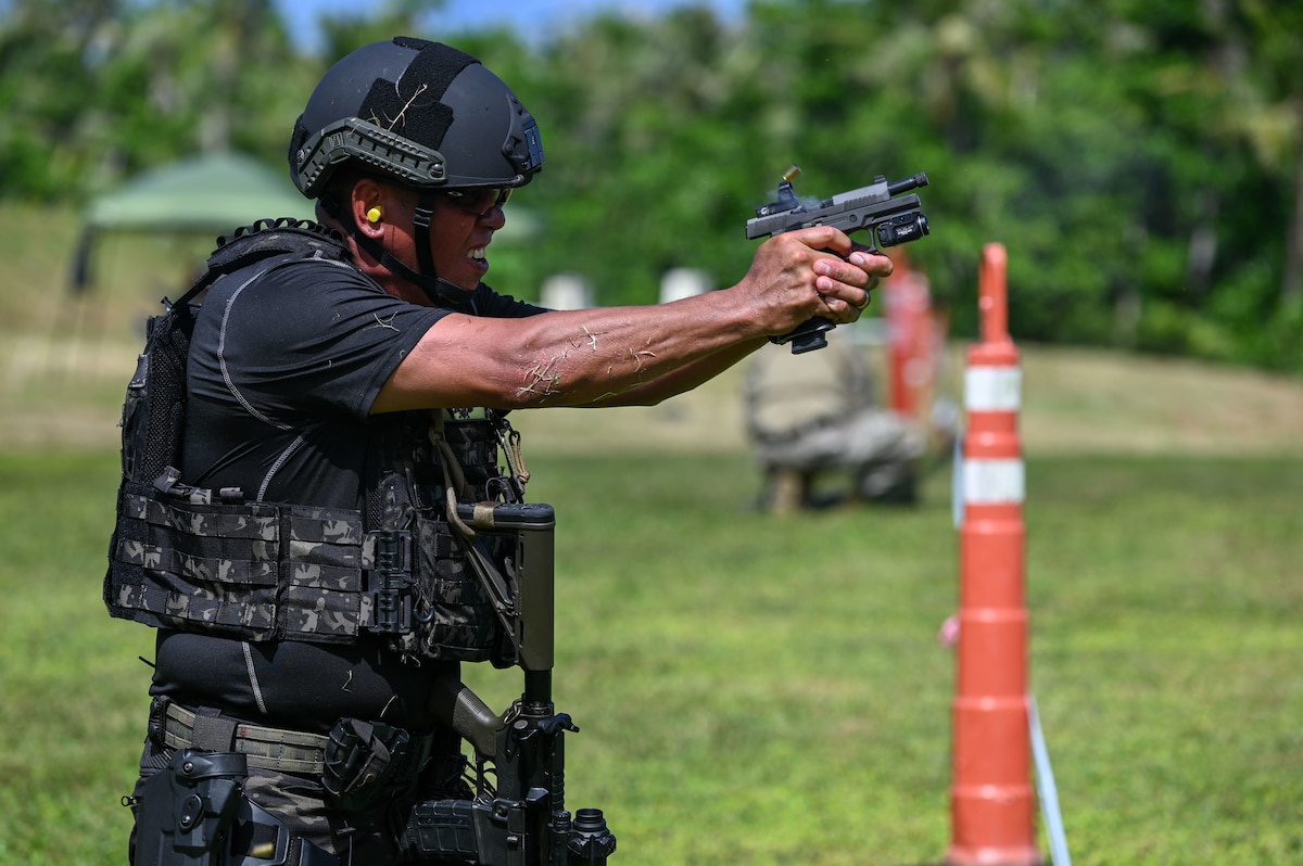 Sgt. Carl Cruz from the Guam Police Department Special Operations Division, fires his weapon during a shooting competition on Andersen Air Force Base, Guam, Nov. 22, 2024. GPD finished with the highest overall score for speed and accuracy, earning the title of the 2024 Battle of the Branches Champion. (U.S. Air Force photo by Airman 1st Class Natasha Ninete)