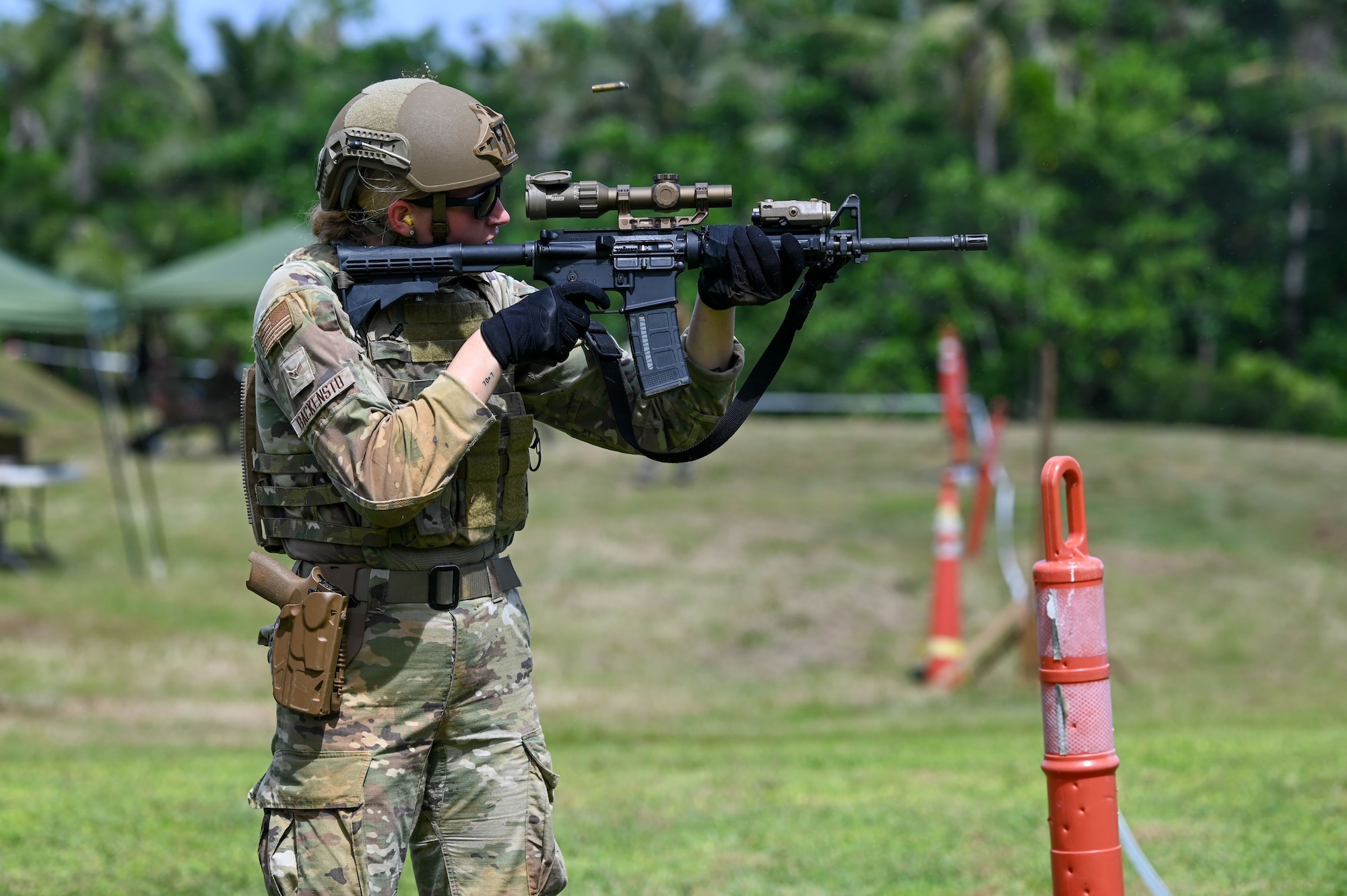 U.S. Air Force Airman 1st Class Kelsie-Jay Backensto, law enforcement patrolman, 36th Security Forces Squadron, fires a weapon downrange during a shooting competition on Andersen Air Force Base, Guam, Nov. 22, 2024. 36 SFS was one of seven competing teams finishing with the fastest overall time. (U.S. Air Force photo by Airman 1st Class Natasha Ninete)