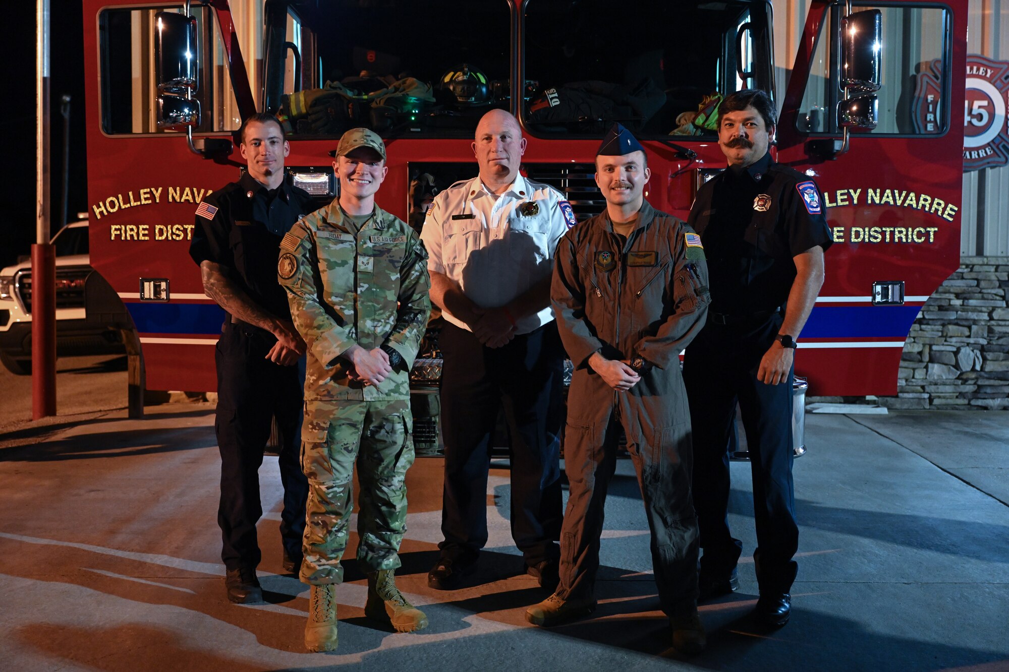 U.S. Air Force Airmen, civilians and Holley-Navarre Fire District firefighters pose for a group photo at the Holley-Navarre Fire District Station 45, in Navarre Florida, Nov. 25, 2024.