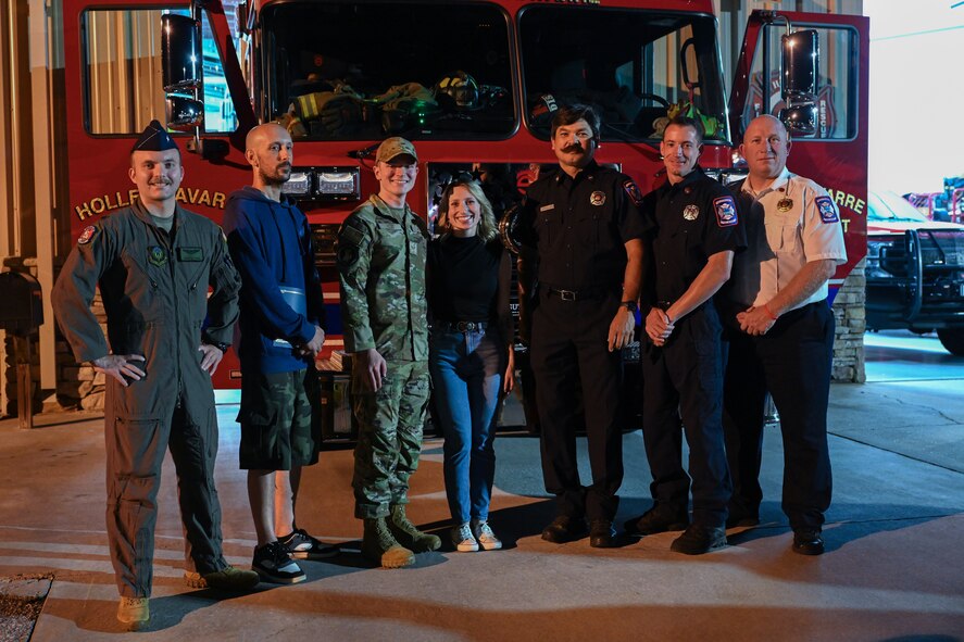 U.S. Air Force Airmen, civilians and Holley-Navarre Fire District firefighters pose for a group photo at the Holley-Navarre Fire District Station 45, in Navarre Florida, Nov. 25, 2024.