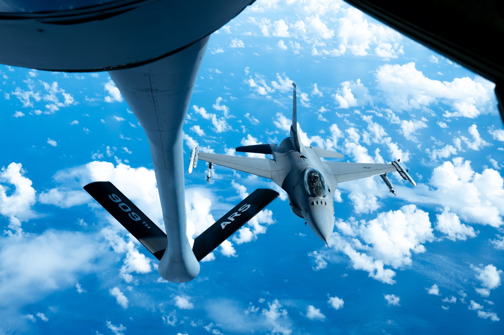 An aircraft prepares to conduct aerial refueling.
